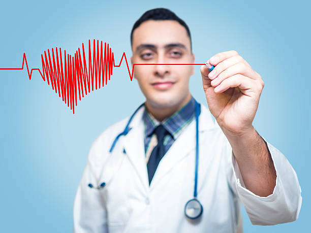 istock Male doctor drawing heart symbol 636577906
