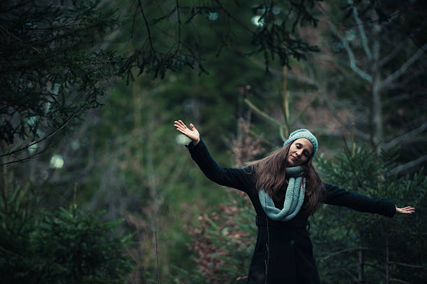istock young women in a forest on a stump 636579308