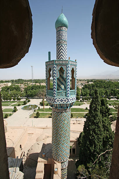 istock Tiled minaret towers over mosque in Kerman 636579380