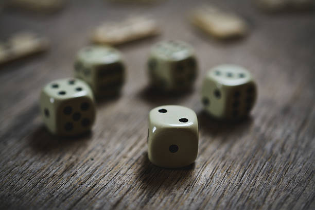 istock dice closeup on a wooden table 636580196