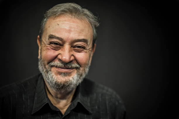 istock Senior Man Portrait on Black Background 636581634