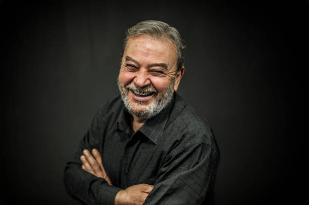 istock Senior Man Portrait on Black Background 636581656