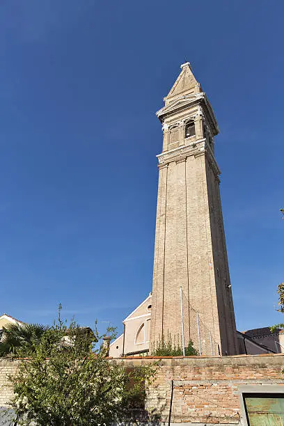 Photo of Leaning tower of San Martino church on Burano island, Italy.