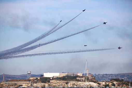 San Francisco, California, USA - Oct. 8, 2016. US Navy Blue Angels perform a maneuver above Alcatraz Island at San Francisco annual Fleetweek airshow event