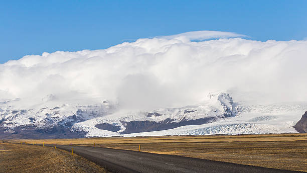istock Ring road passing Vatna Glacier in South Iceland with clouds 636585082