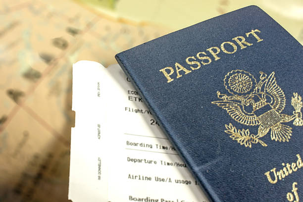 istock USA passport and boarding pass over a  map of Canada 636587242