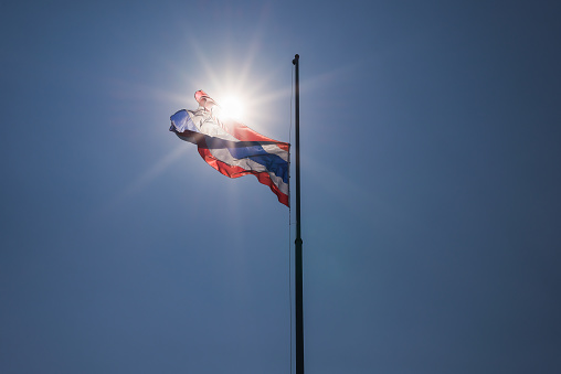 Thai flag was lowered to half-mast on sunlight