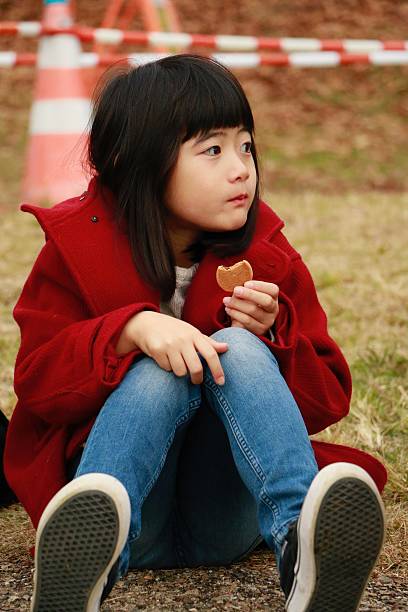 Little girl eating biscuit