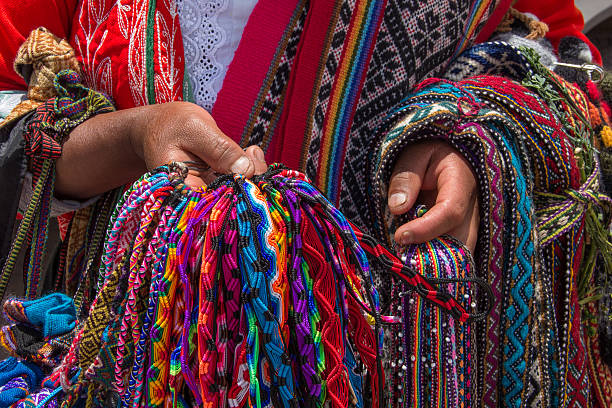 istock Peruvian Indigenous selling traditional colorful handmade bracelets 636589838