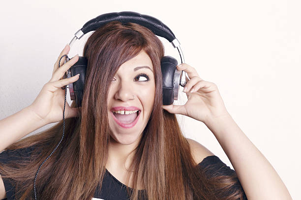 istock Woman with headphones having fun. 636589926