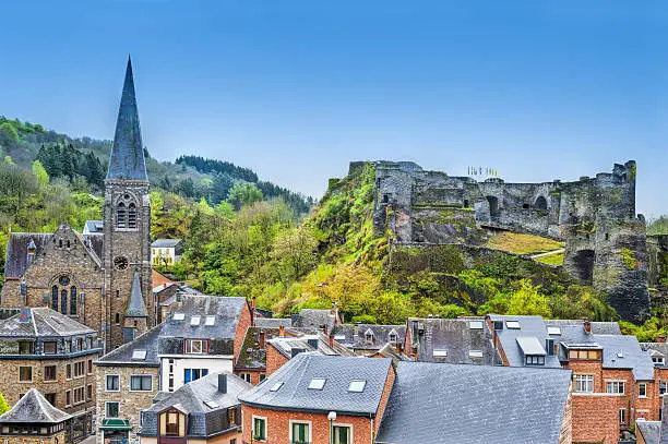 View of the Church and the Castle in the Belgian City of La Roche. View of the town centre below its medieval Castle in of La Roche.