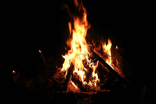 istock bonfire at night and candles 636593572