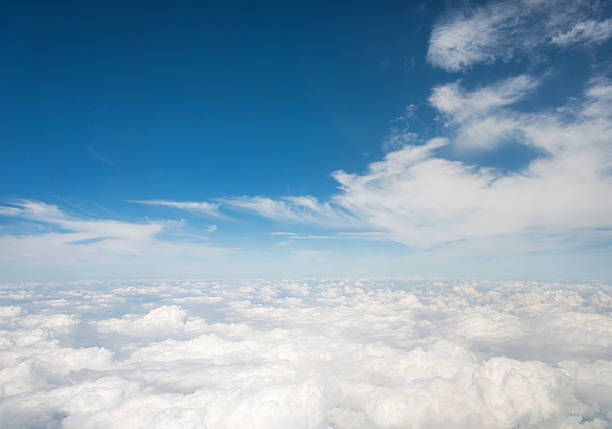 istock Above the clouds view from an airplane 636593592