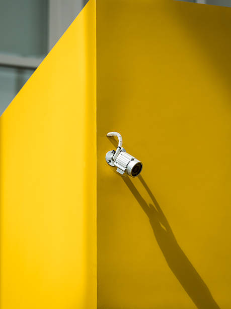 istock aluminum closed circuit camera for security on the yellow concre 636594600