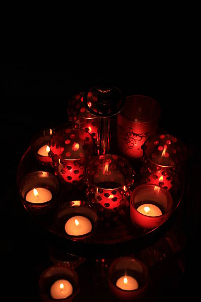 istock Red votives and candles 636594656