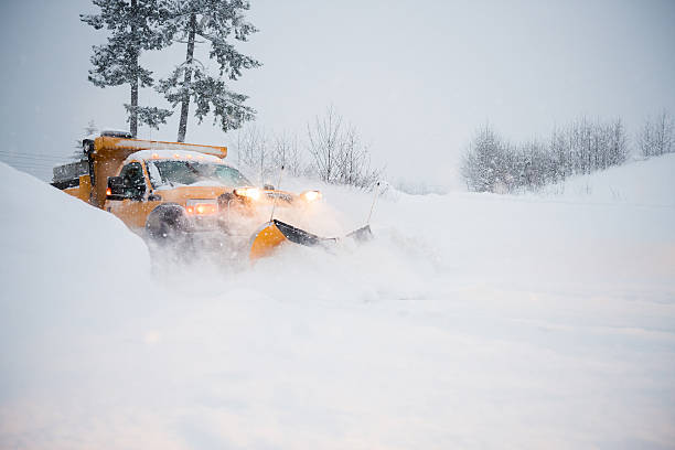 istock Snow plow clearing a snowy highway 636594762