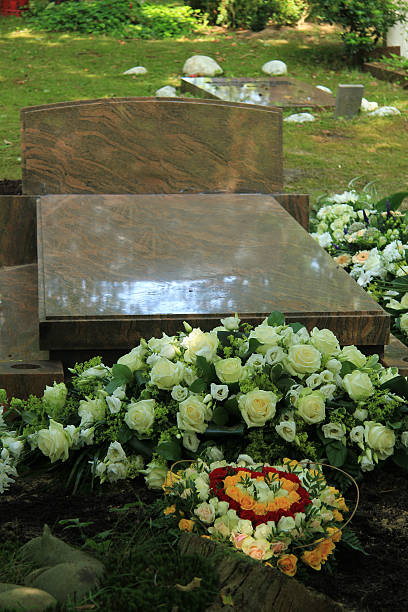 istock Sympathy flowers on a grave 636595156
