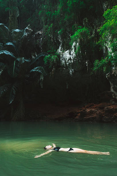 istock Woman swimming in lagoon 636596962