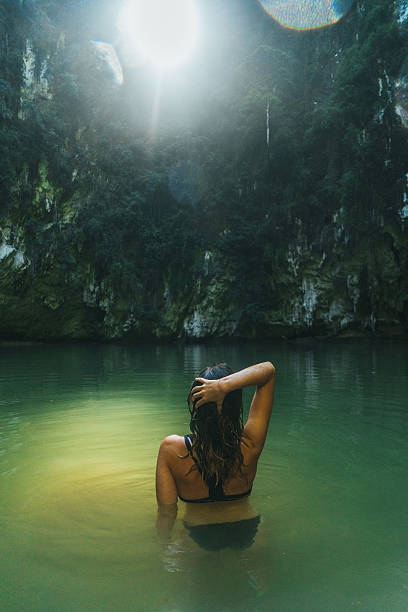 istock Woman swimming in lagoon 636596982
