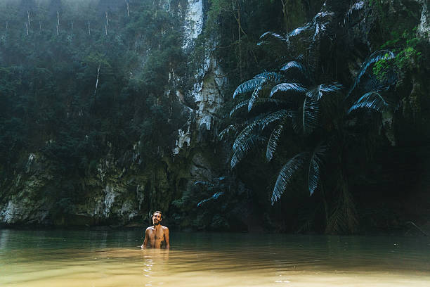 istock Man swimming in lagoon 636597878