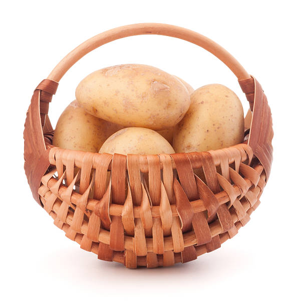 istock Potato tuber  in wicker basket isolated on white background 636598540