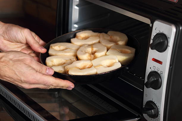 istock Place in oven frying pan with pears 636602290