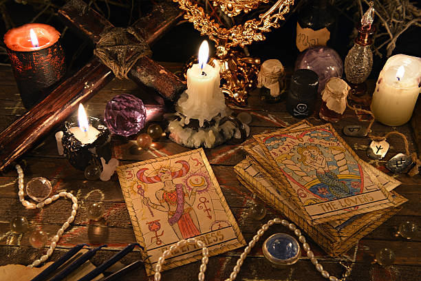 Mystic ritual with tarot cards, magic objects and candles stock photo