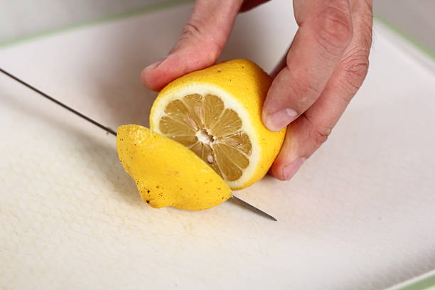 istock Cutting top of lemon 636605836