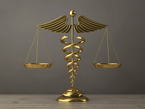 istock Golden Medical Caduceus Symbol as Scales. 3d Rendering 636607456