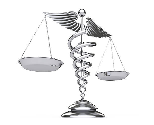 istock Silver Medical Caduceus Symbol as Scales. 3d Rendering 636607478