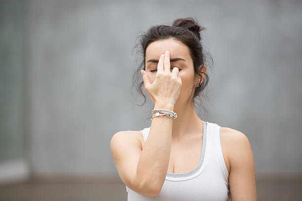 istock Beautiful Yoga: Alternate Nostril Breathing 636607546