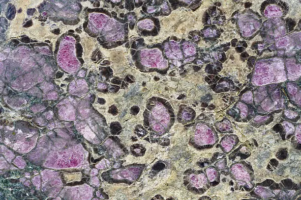 Mineral background. Eclogite stone macro detail. Geology gemstone. Horizontal