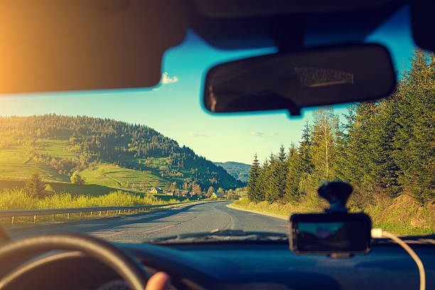 istock Driving a car on mountain road 636608980