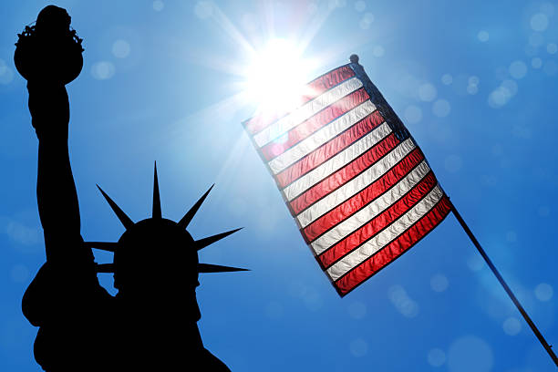 istock liberty and american flag 636614572