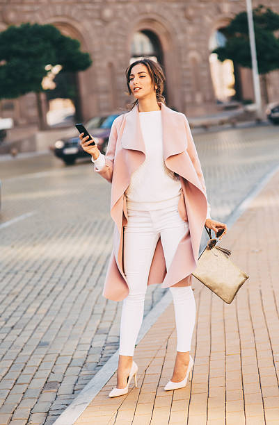 istock Beautiful woman texting on the phone 636615106