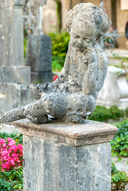 istock Stone Angel statue in ancient cemetery 636616574