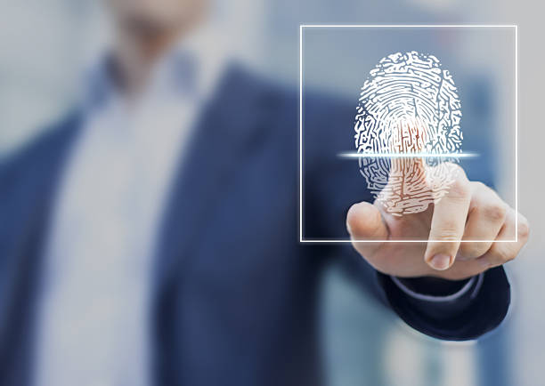 Fingerprint scan provides security access with biometrics identification Fingerprint scan provides security access with biometrics identification, person touching screen with finger in background biometrics stock pictures, royalty-free photos & images
