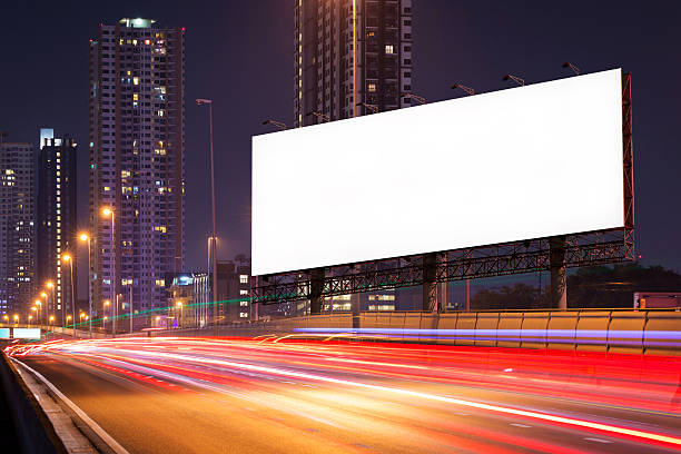 istock Blank billboard on light trails, street and urban in night 636621054