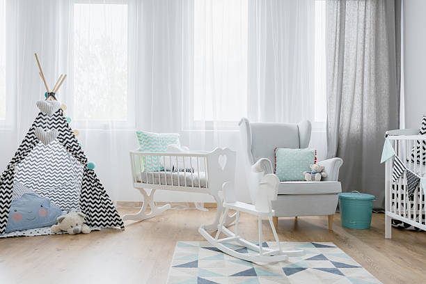 istock Friendly baby room decor in white and blue 636621134