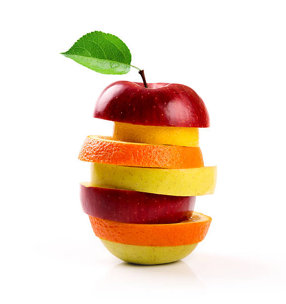 白で分離されたミックスフルーツスライス - apple stack red fruit ストックフォトと画像