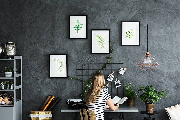 istock Woman reading at the desk 636623592