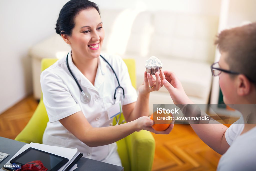 Female doctor nutritionist and teenager patient Diabetes Stock Photo