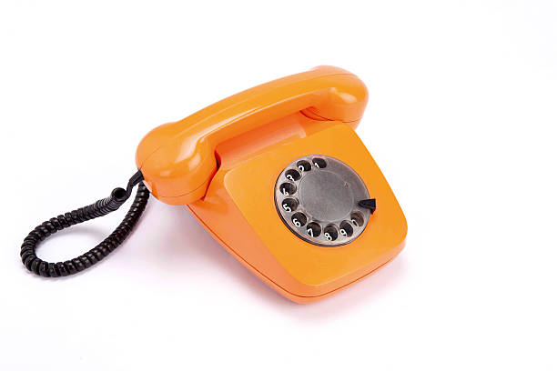 istock Orange retro telephone 636625998