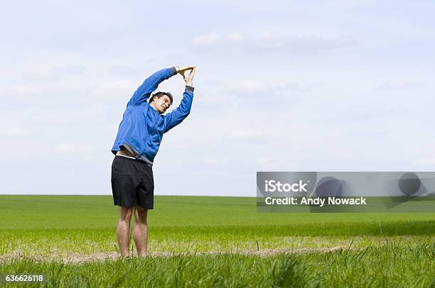 Stand Andt Stretchhorizontal Stock Photo - Download Image Now - Active Lifestyle, Adult, Adults Only