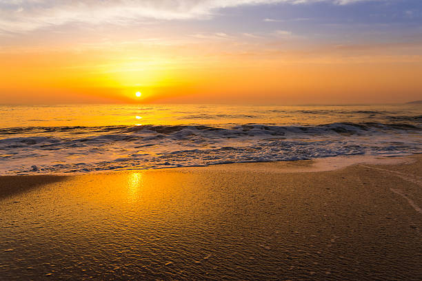 istock Golden sunrise sunset over the sea ocean waves 636627984