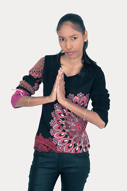 istock Beautiful woman doing different expressions in different sets of clothes: prayer 636628874
