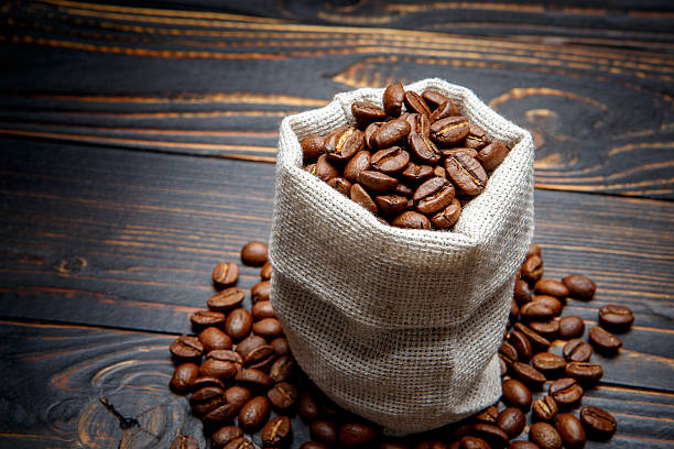 istock roasted coffee beans on wooden background 636632458