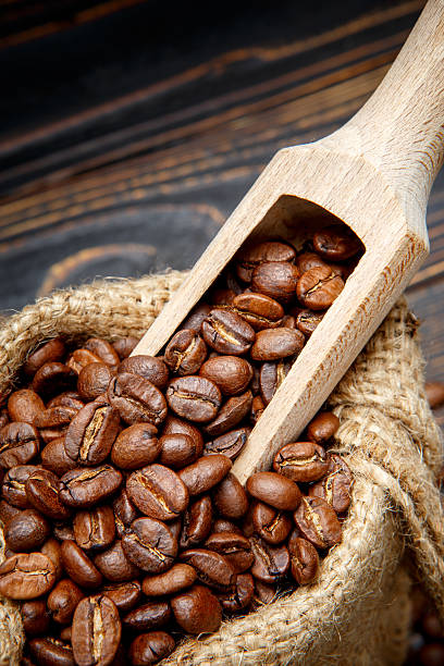 istock roasted coffee beans on wooden background 636632940