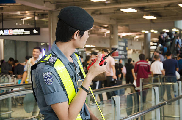 Airport Security Guard standing for security stock photo