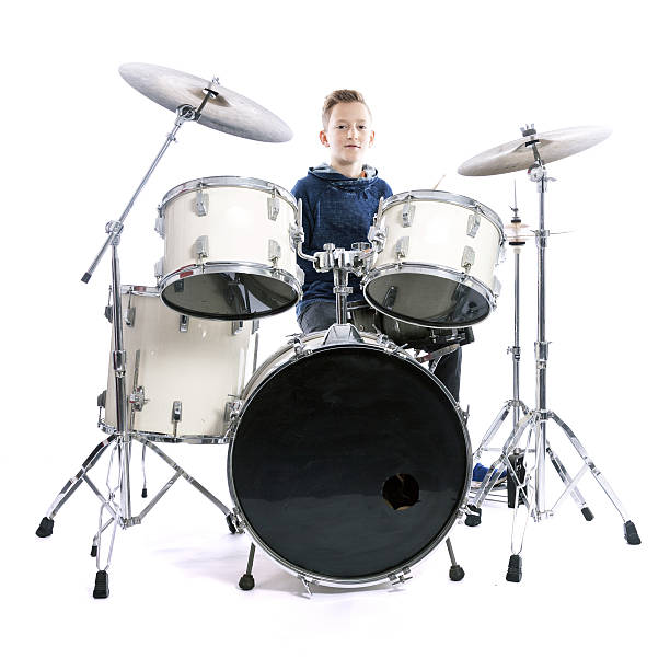 istock teenage boy behind drum kit in studio 636638126